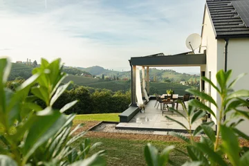 Foto op Plexiglas The terrace of the house offers views of the hills and vineyards. Austria © Anna