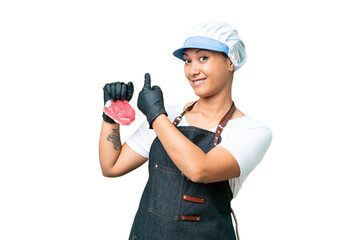Butcher woman wearing an apron and serving fresh cut meat over isolated chroma key background...