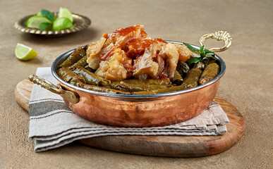 Stuffed vine leaves topped with trotters closeup
