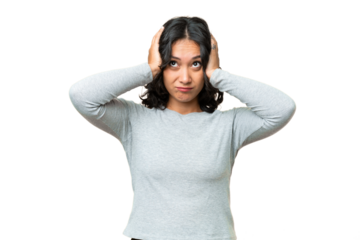 Young Argentinian woman over isolated background frustrated and covering ears