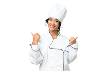 Young chef Argentinian woman over isolated background with thumbs up gesture and smiling