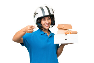 Young Argentinian deliver fast food over isolated background points finger at you with a confident expression