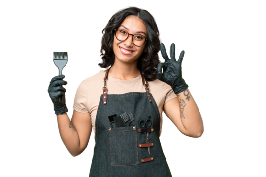 Young argentinian hairdresser woman over isolated background showing ok sign with fingers