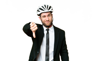 Business person with a bike helmet over isolated chroma key background showing thumb down with negative expression