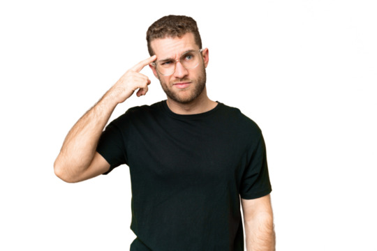 Young handsome blonde man over isolated chroma key background making the gesture of madness putting finger on the head