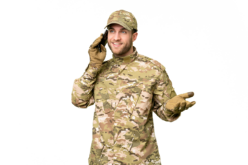 Military man over isolated chroma key background keeping a conversation with the mobile phone with someone