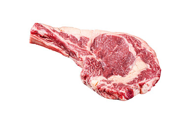 Dry aged raw tomahawk or cowboy beef steak on a black table with knife, cleaver, spice and herbs...