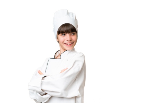 Little caucasian chef girl over isolated background with arms crossed and happy