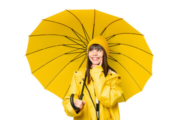 Little girl with rainproof coat and umbrella over isolated chroma key background thinking an idea...