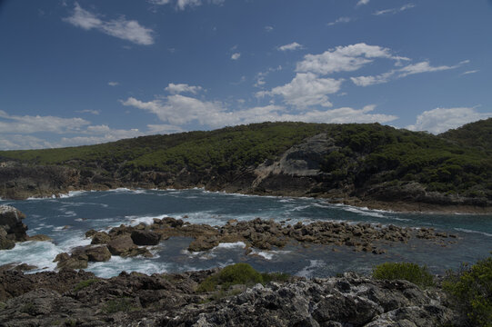 Rocky outcrop thrust out into the bay.