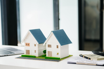 balancing the property sector The real estate agent is explaining the house style to see the house...
