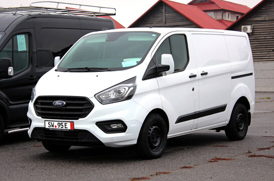Vinnytsia, Ukraine; November 08, 2023. White Ford Transit Custom Cargo Van at the city street. Ford Transit Custom at the parking. Cargo delivery vehicle. Front left view.