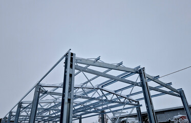 Building construction from metal trusses. lattice structure of the frame of an industrial building....