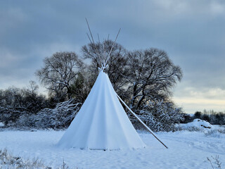 the teepee tent is equipped on the inside with furniture for groups of children in kindergarten....