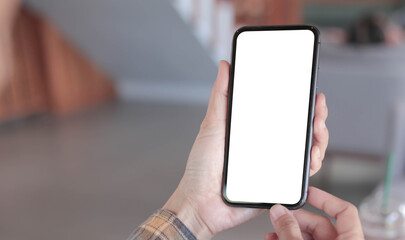 cell phone blank white screen mockup.hand holding texting using mobile on desk at office.background empty space for advertise.work people contact marketing business,technology