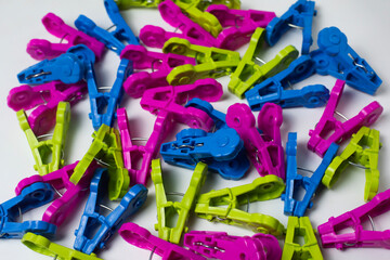 Plastic clothes pegs, assorted colors, bright and colorful, placed all over the area. For various...