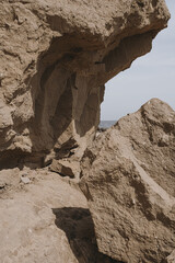 Closeup view of rock at coastline with seaside view