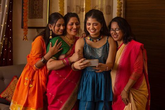 Portrait of three generation family having fun on Diwali at home
