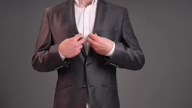 Radiate positivity and good fortune with this uplifting stock video capturing a moment of optimism as a man raises two fingers in a V gesture. The scene opens with a dynamic close-up, focusing on the 