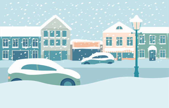 City buildings covered with snow after heavy blizzard.  Parked cars on the street in snowdrifts during snowfall