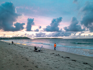 Fishing at Narin, Portnoo strand during amazing sunset in County Donegal - Ireland