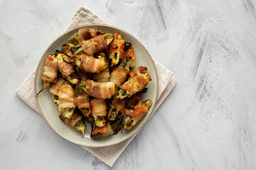 Homemade Bacon-Wrapped Jalapeno Poppers on a Plate, top view. Copy space.