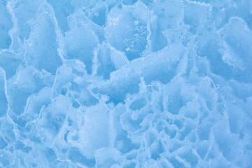 Texture of winter ice surface. Blue natural ice background