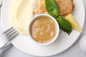 Delicious turkey gravy served on table, top view