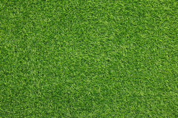 Obraz premium Green artificial grass as background, top view
