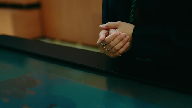 hands of a Muslim woman worker at an exhibition center in Dubai