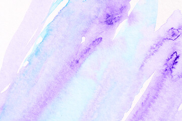 Abstract liquid art background. Blue purple watercolor translucent blots on white paper.