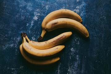 Close-up of bananas on blue textured background