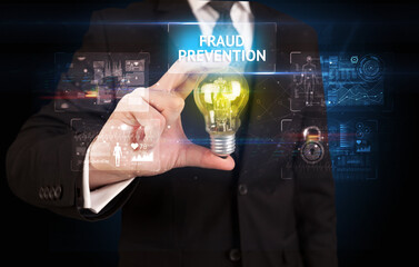 Businessman holding a light bulb, online security concept