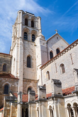 Fototapeta na wymiar exterior facade and bell tower of landmark saint mary magdalene basilica in vezelay france