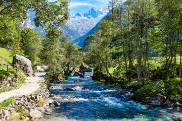 Alpine landscape on the stream flowing in the Val di Mello in Valtellina Sondrio Italy