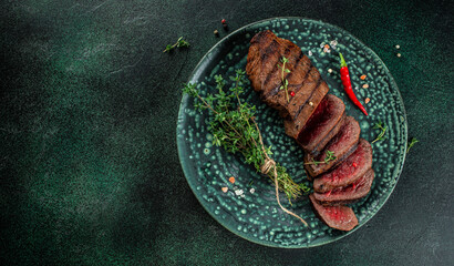 Beef meat steak sliced on plate. Restaurant menu, dieting, cookbook recipe top view