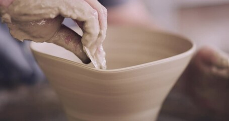 Person hands, pottery and bowl design for startup or small business production with clay tools, scraper and creativity. Entrepreneur or artist with mud sculpture for ceramic in a workshop or studio