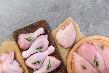 Raw chicken meat on gray background.