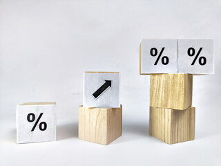 Wooden cubes with arrows and percentages on a black background. Stages of action and goal achievement. Planning. Business actions. Receiving income and profit