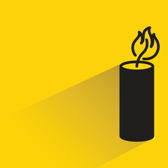 candle with shadow on yellow background