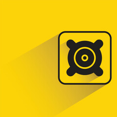 audio loudspeaker with shadow on yellow background