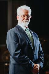 Confident university rector in a library. Mature Caucasian male with academic experience exudes...