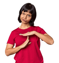 Young Hispanic woman with short black hair in studio showing a timeout gesture.