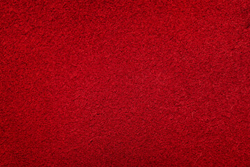Macro texture of red suede. Red suede leather background.