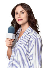 Young Caucasian journalist with microphone in studio setting