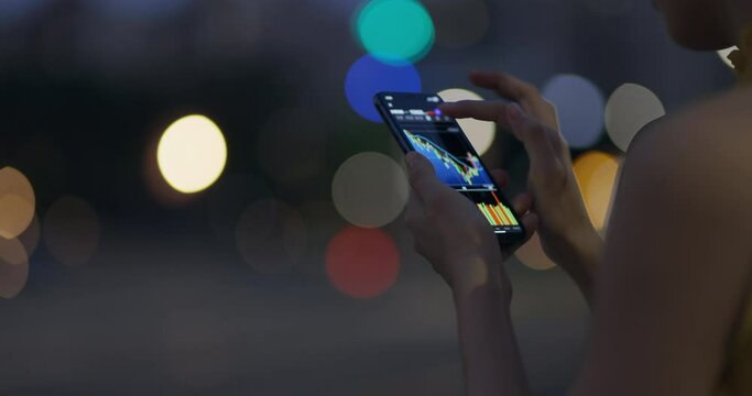 Woman invest online stocks trading on mobile platform app