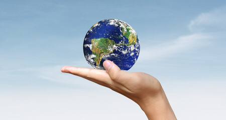 Glass globe in hand,Energy saving concept