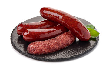 Grilled bratwurst Pork Sausages with basil leaves, close-up, isolated on white background.