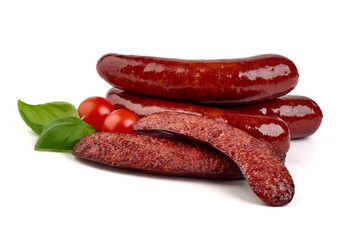 Grilled bratwurst Pork Sausages with basil leaves, close-up, isolated on white background.