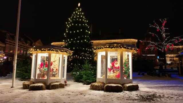 Copenhagen decorated for Christmas holidays, Denmark, Viborg, Shopping street in historical center of Aarhus decorated for New Year holidays, Pedestrians Christmas shopping on Stroget at night.